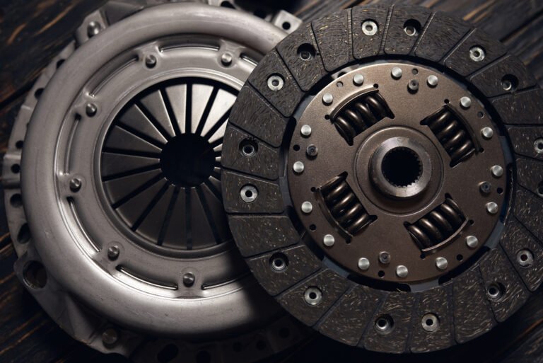 new car clutch kit on a dark wooden background
